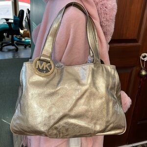 Michael Kors  NYE bag, shoulder bag   gold metallic leather  Gold tone hardw
EUC